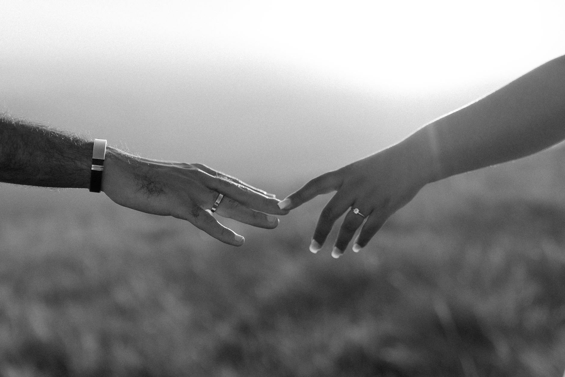 10 Accessory Mistakes Secretly Ruining Your Outfits (+ Fix) Romantic gesture of two hands reaching out, symbolizing connection and love.